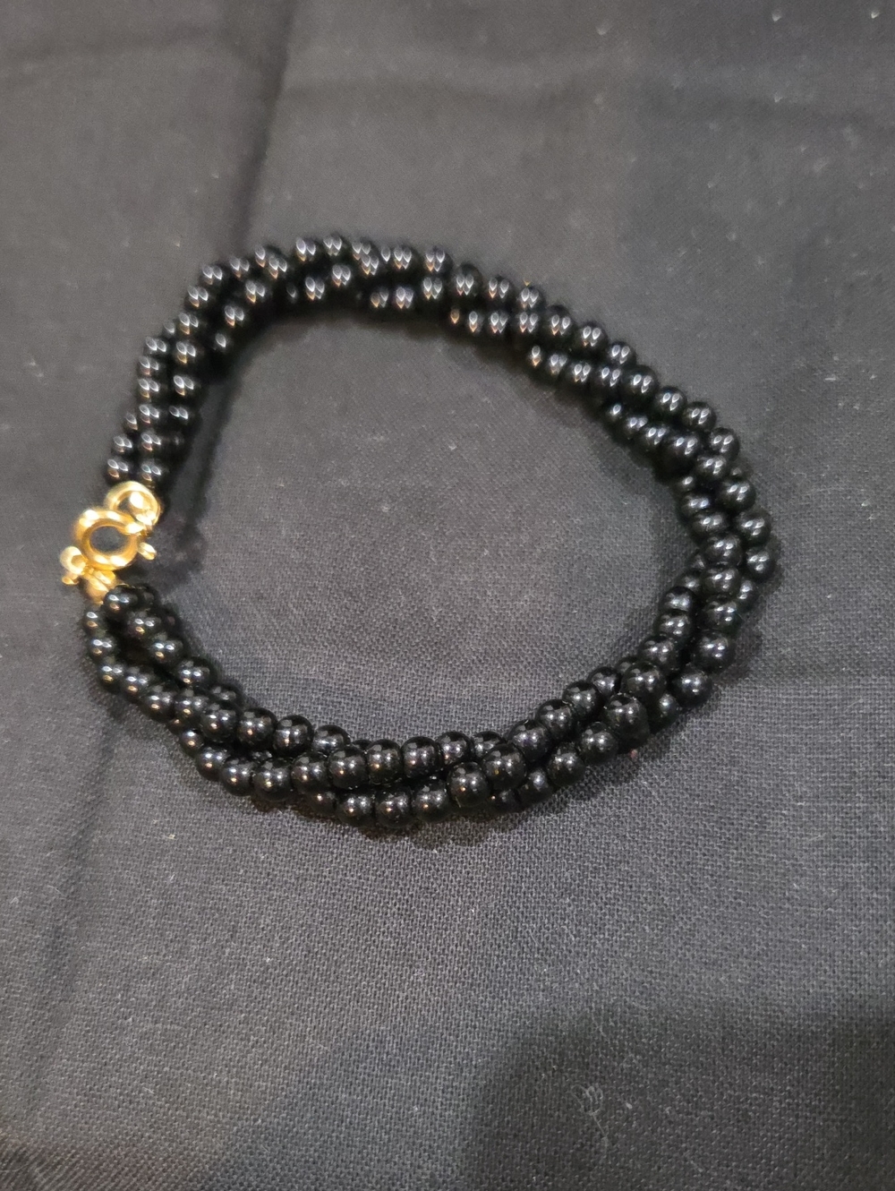 MULTI STRAND BLACK BEADED BRACELET